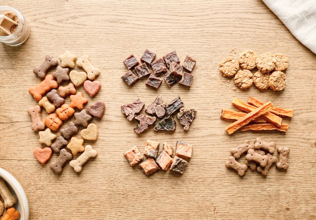 Different treats on the table for the dog.